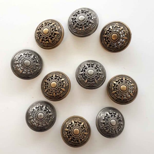 They are solid metal buttons with a geometric design