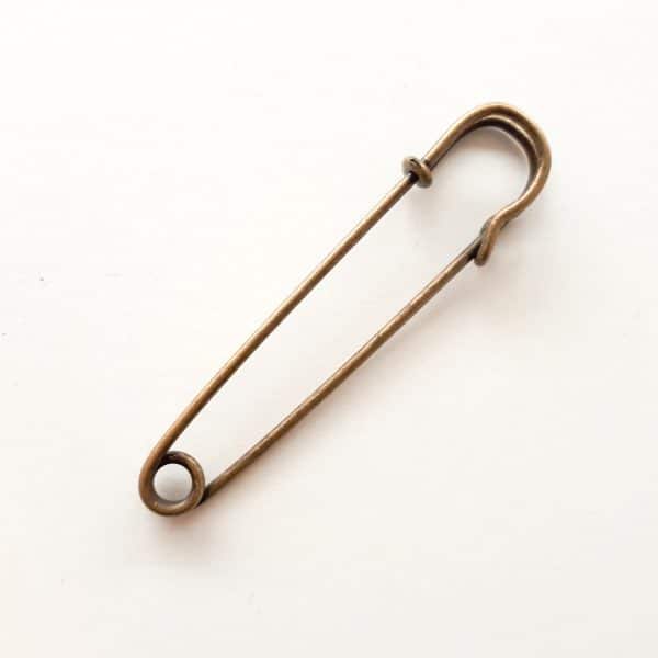 Kilt pin in brass colour