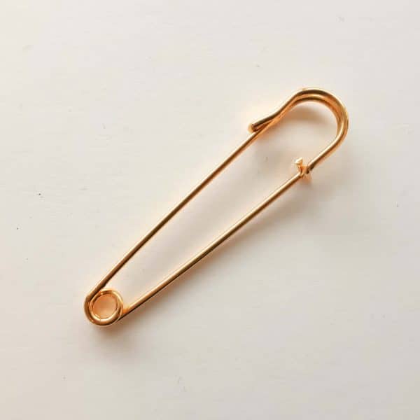 Kilt pin in gold colour