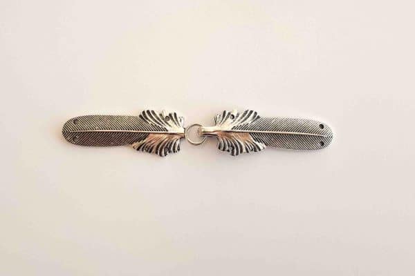 Feather cloak clasp in aged silver
